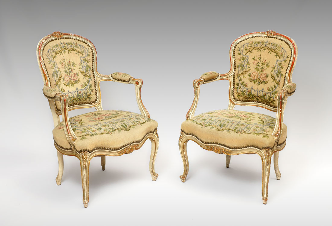 Appraisal: PAIR TH CENTURY FRENCH FAUTEUIL ARMCHAIRS Paint decorated frames with