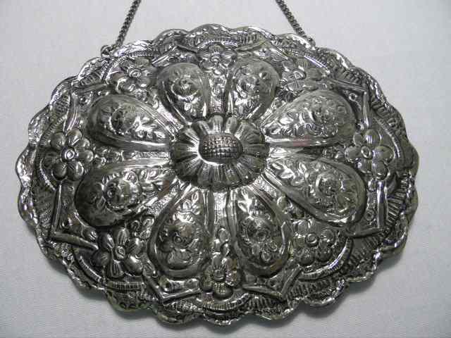 Appraisal: Turkish hanging mirror clad with floral embossed silver Stamped on