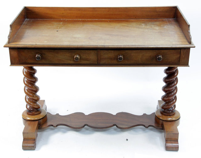 Appraisal: A Victorian mahogany washstand with three-quarter gallery fitted two frieze