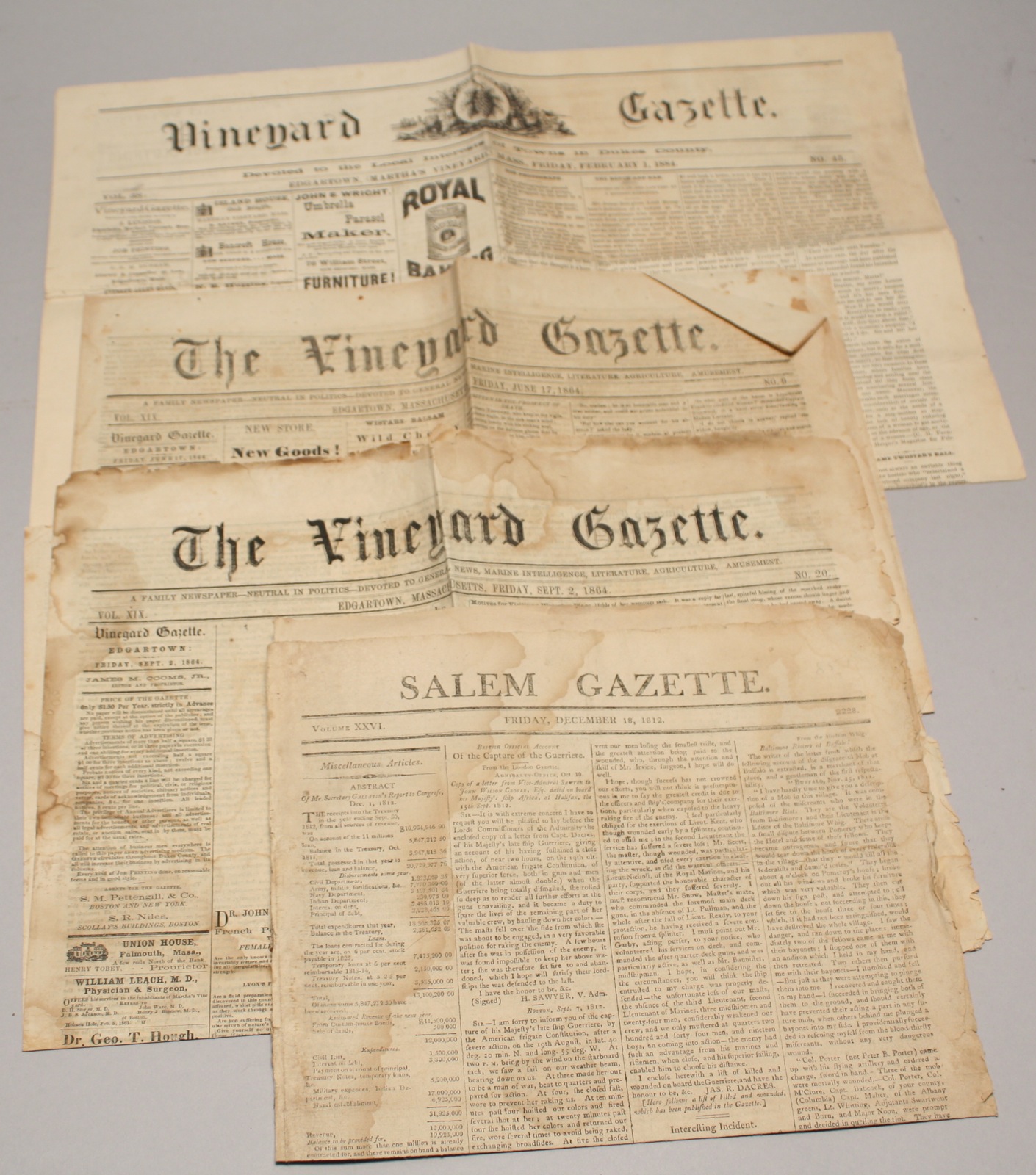 Appraisal: FOUR UNFRAMED NEWSPAPERS th CenturyThree editions of the Vineyard Gazette