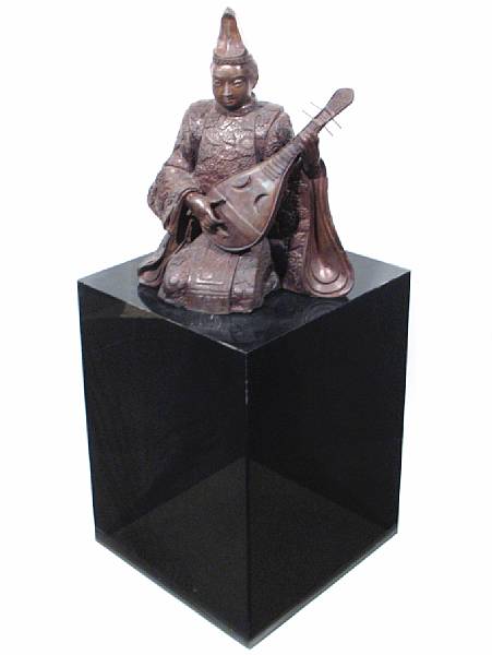 Appraisal: A large bronze of a Japanese kneeling musician on a