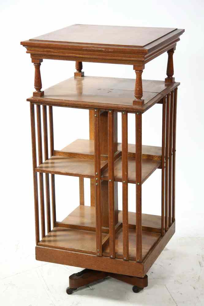 Appraisal: LIBRARY STAND - Circa golden oak rotating library stand on