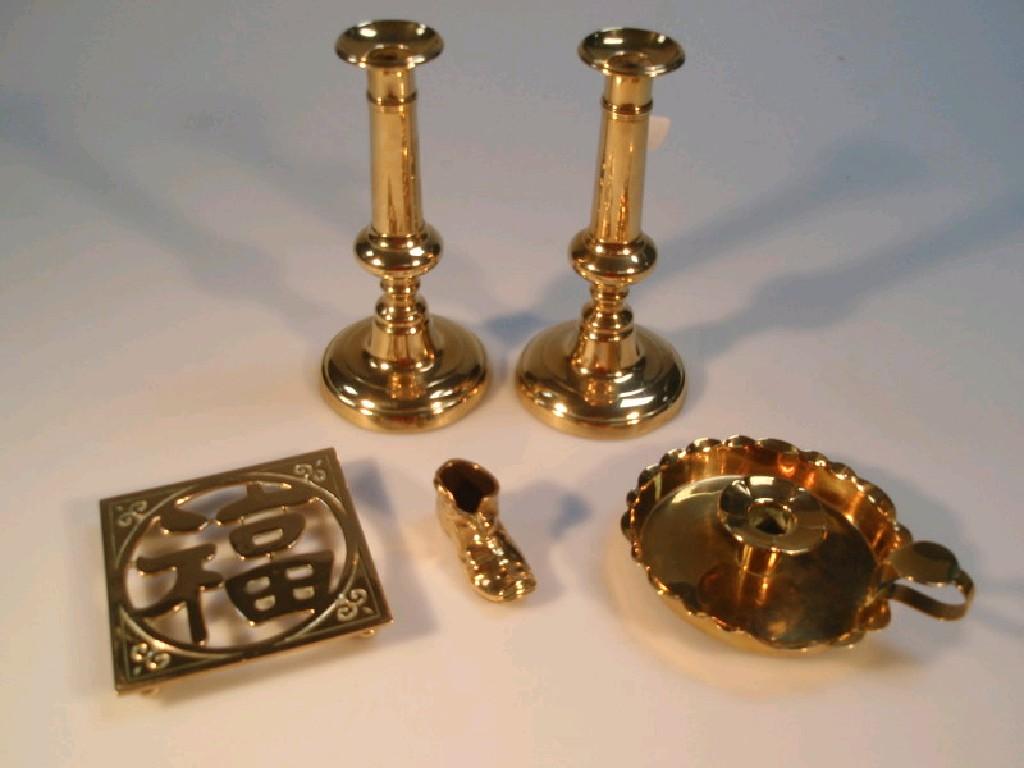 Appraisal: A pair of thC brass baluster candlesticks with ejectors cm