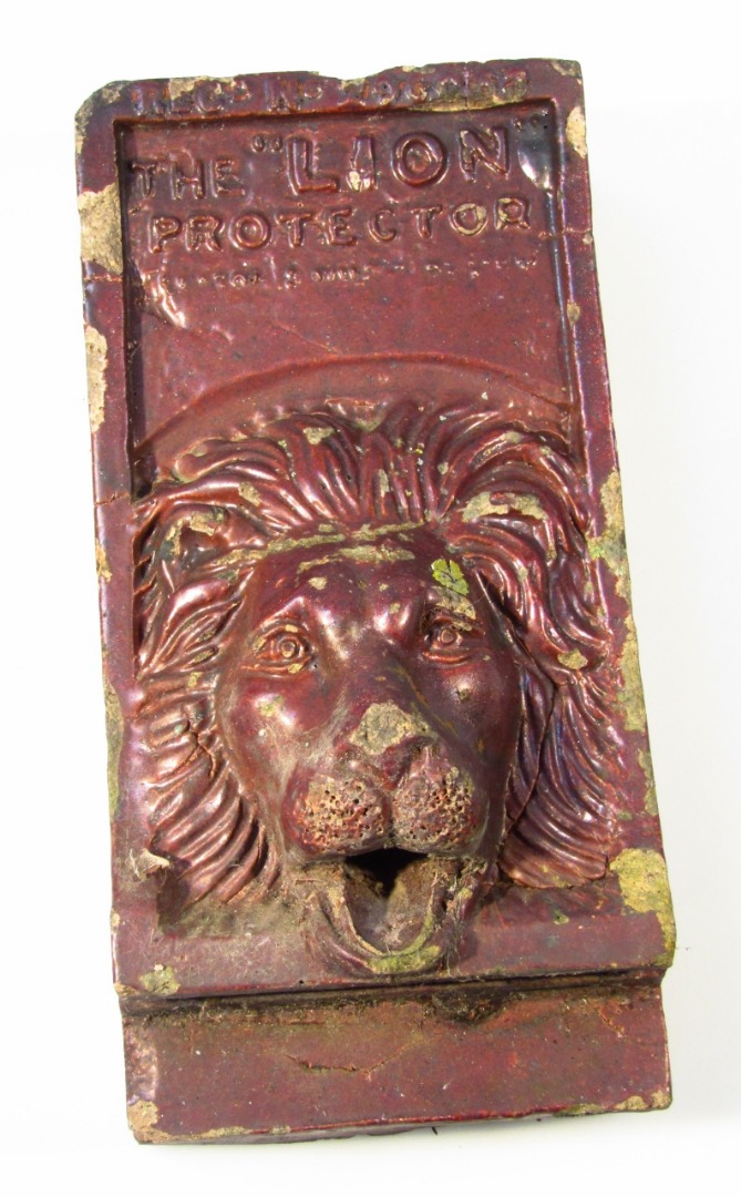 Appraisal: A thC stoneware Lion Protector fountain head the rectangular outline