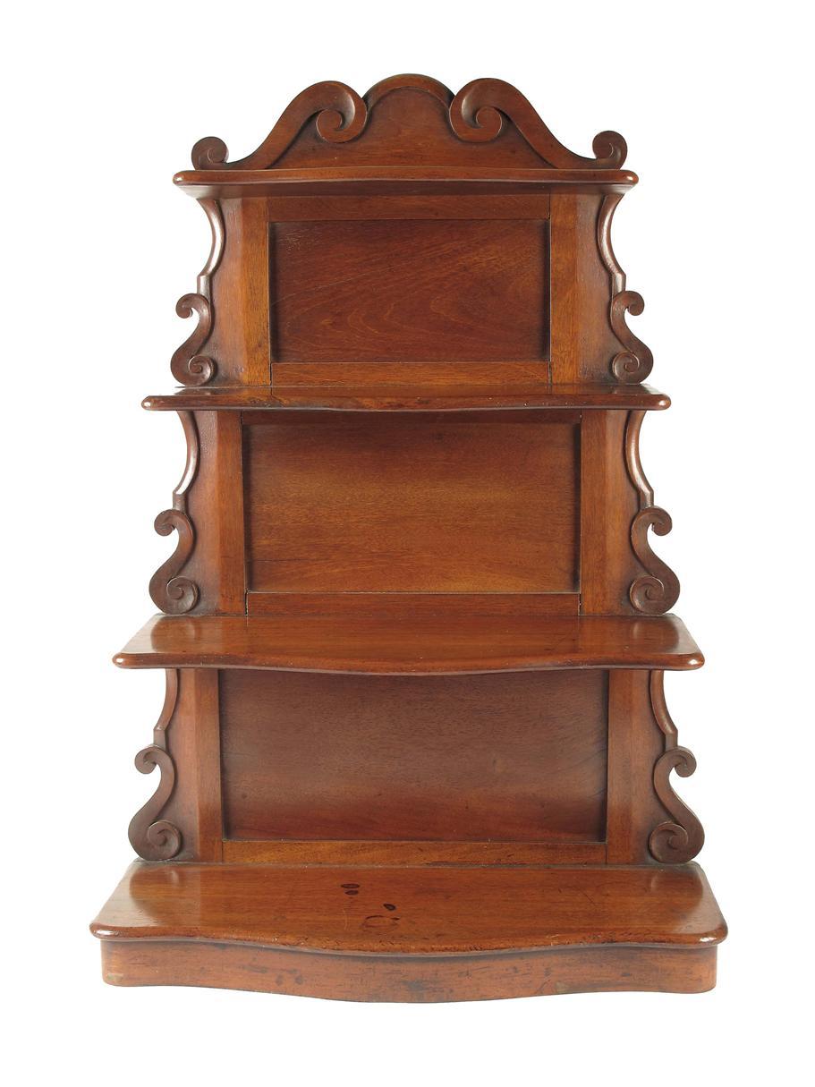 Appraisal: A set of Victorian mahogany serpentine front table top shelves