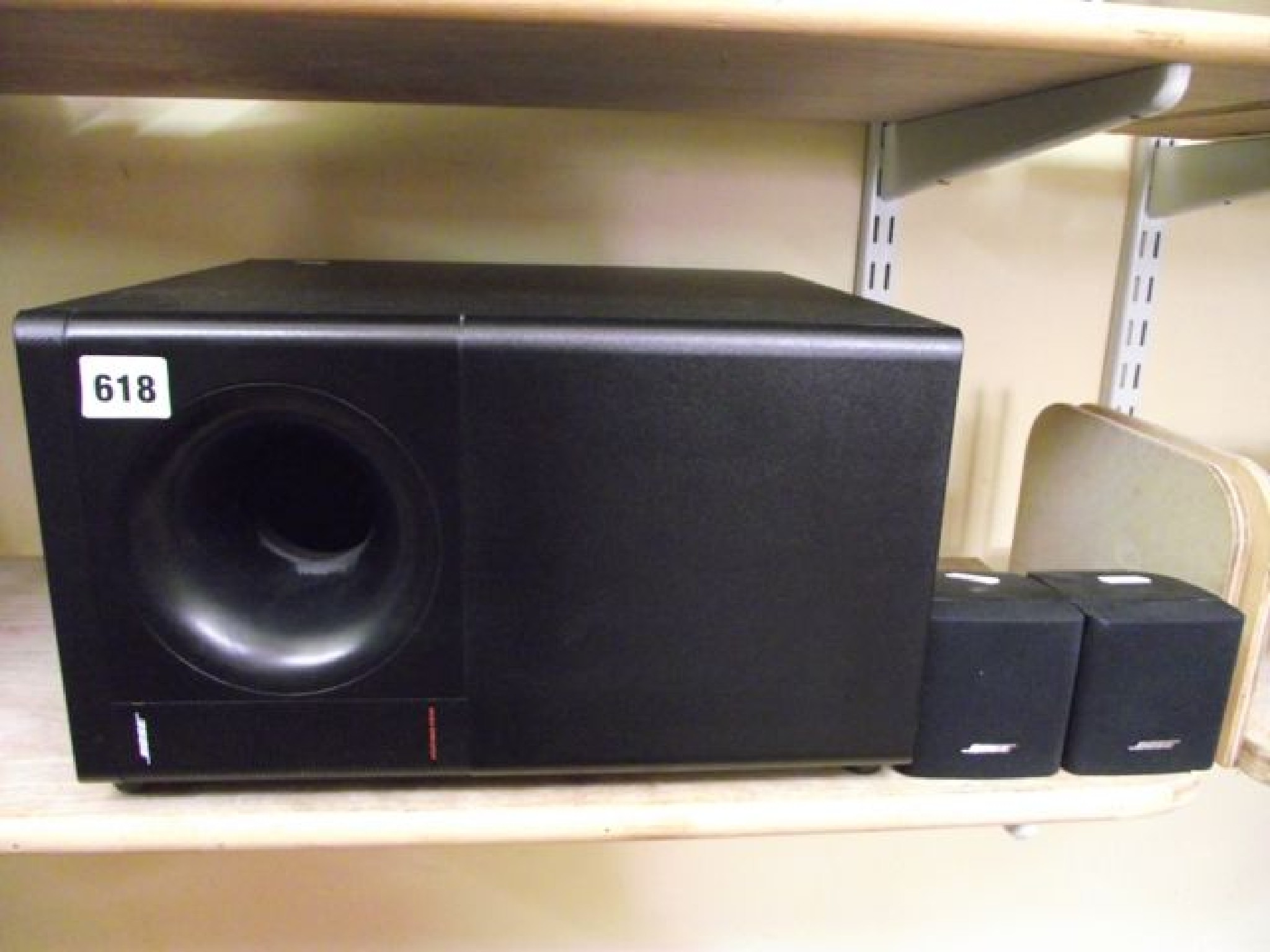 Appraisal: A Bose Acoustimass Series speaker system the central speaker flanked