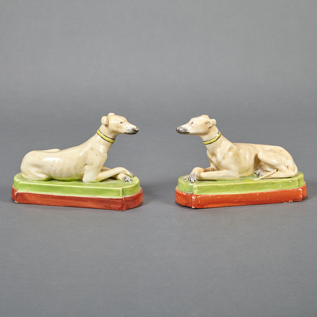 Appraisal: Pair of Staffordshire Pottery Recumbent Figures of Hounds th Century