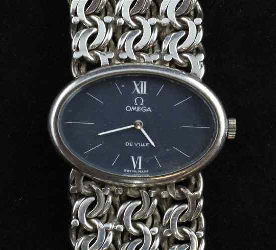 Appraisal: A lady's 's silver Omega wrist watch with oval blue