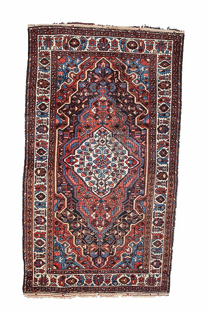 Appraisal: A HAMADAN BROWN GROUND RUG with a central white medallion