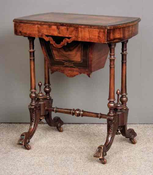 Appraisal: A Victorian walnut rectangular work table inlaid with ebonised bandings