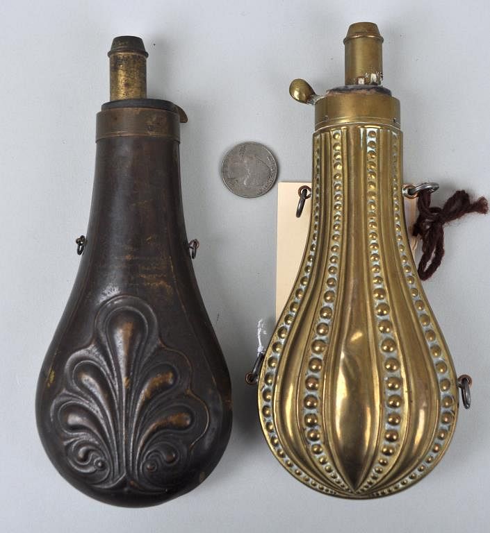 Appraisal: Two Antique Powder Flasks brass and steel both with raised