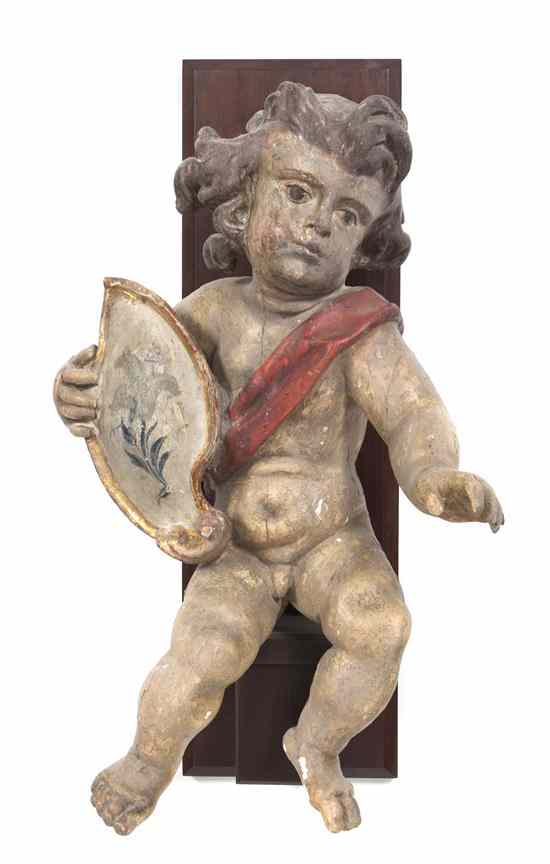 Appraisal: A Continental Polychrome Plaster Putti holding a shield set against