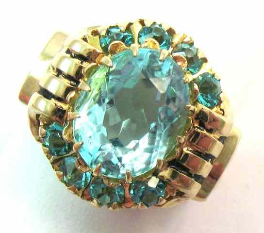 Appraisal: BLUE TOPAZ AND TEN KARAT GOLD RING featuring an oval-cut