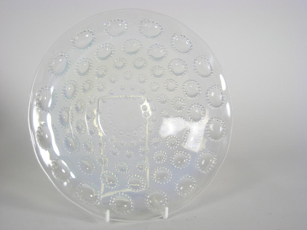 Appraisal: A Lalique circular opalescent glass Bowl moulded prunt design in