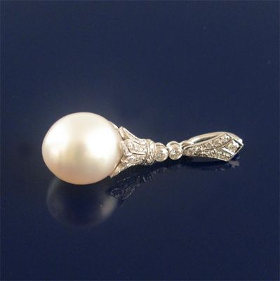 Appraisal: A large cultured pearl and diamond pendant the pearl measures