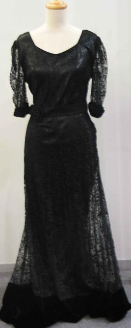 Appraisal: Full length evening dress in black lace complete with original