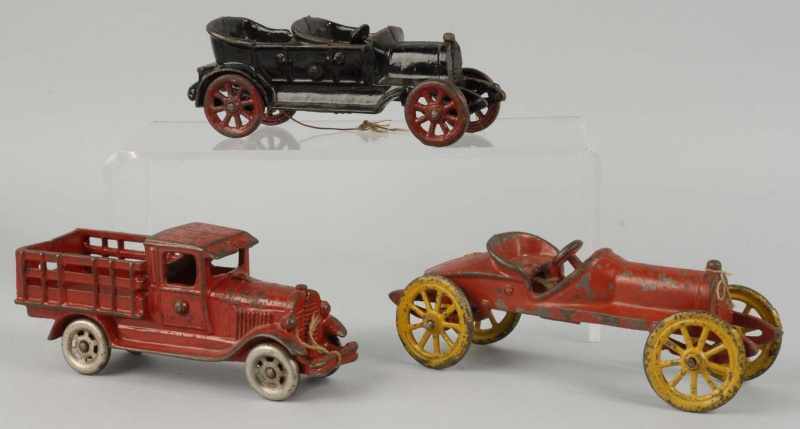 Appraisal: Lot of Cast Iron Vehicle Toys Description American Includes one