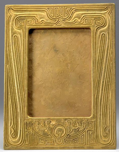 Appraisal: TIFFANY STUDIOS Table-top picture frame in the Chinese pattern gold