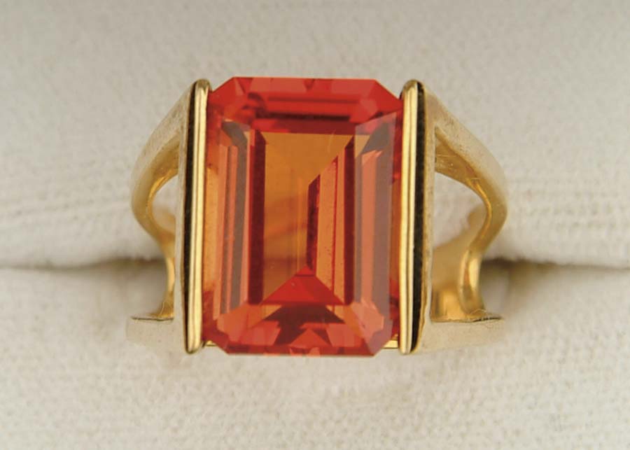 Appraisal: K YELLOW GOLD PADPARADSCHA RING Yellow gold open setting marked