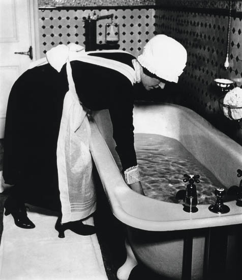 Appraisal: BRANDT BILL - Parlourmaid Preparing a Bath Silver print x