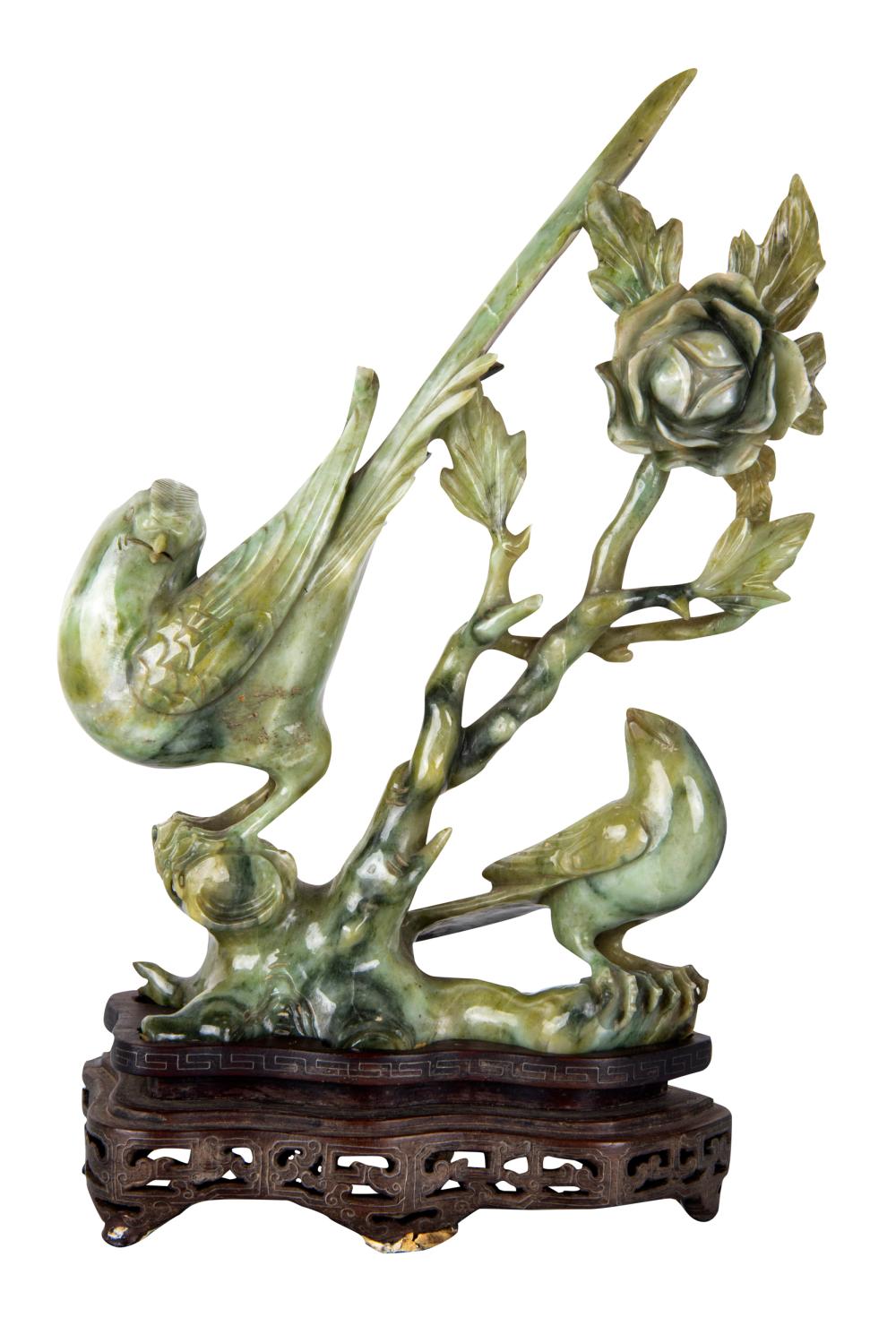 Appraisal: CHINESE CARVED GREEN STONE FIGUREdepicting two peacocks and a flower