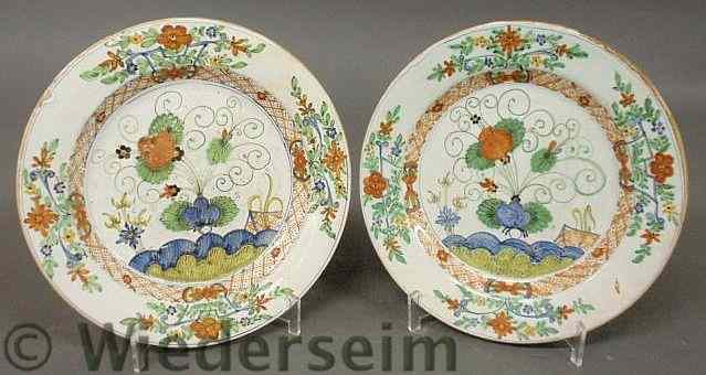 Appraisal: Pair of French faience plates th c with colorful floral