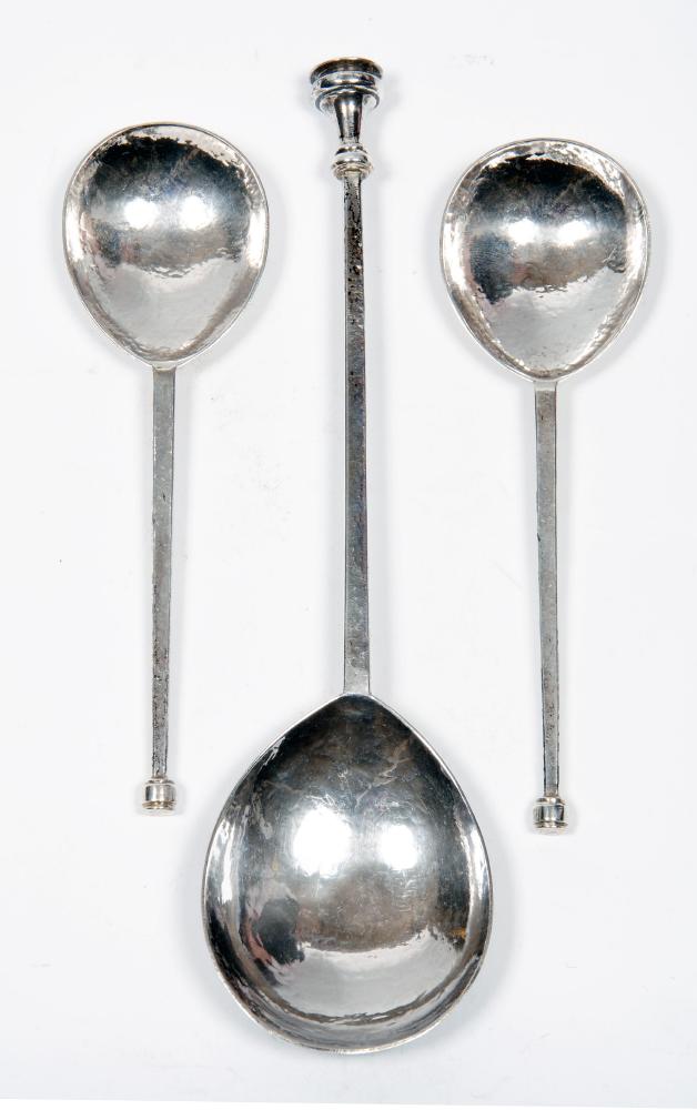 Appraisal: A SET OF THREE ARTS AND CRAFTS SEAL TOP SPOONS