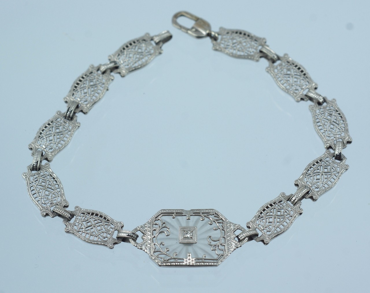 Appraisal: K WG filigree bracelet w crystal diamond center dwt