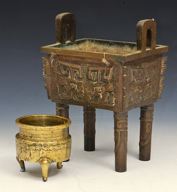 Appraisal: A CHINESE ARCHAIC DESIGN CENSER of Gu form cm across