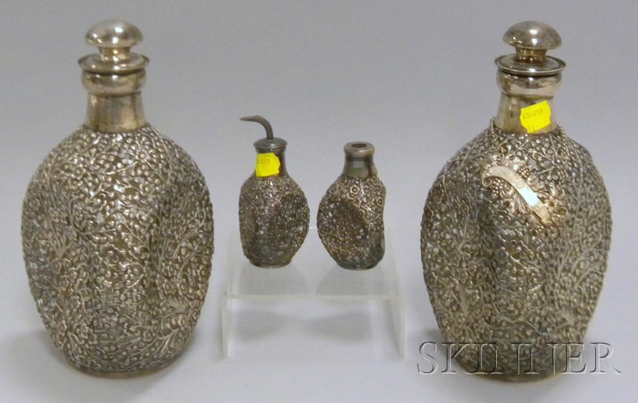 Appraisal: Set of Four Silver Overlay Colorless Glass Bar Bottles marked