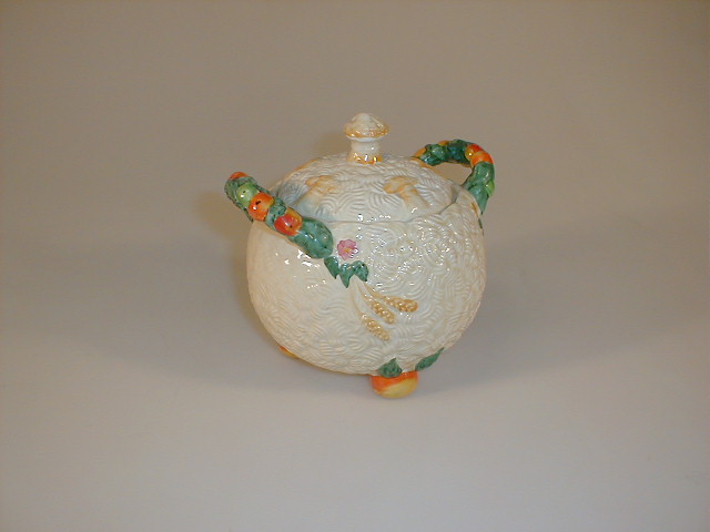 Appraisal: A Clarice Cliff Celtic harvest spherical biscuit barrel and cover