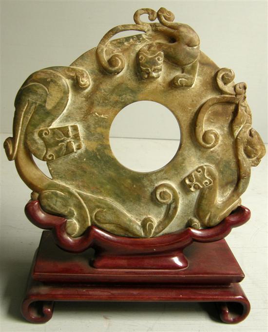 Appraisal: th century Chinese carved stone 'Bi' disc with a central