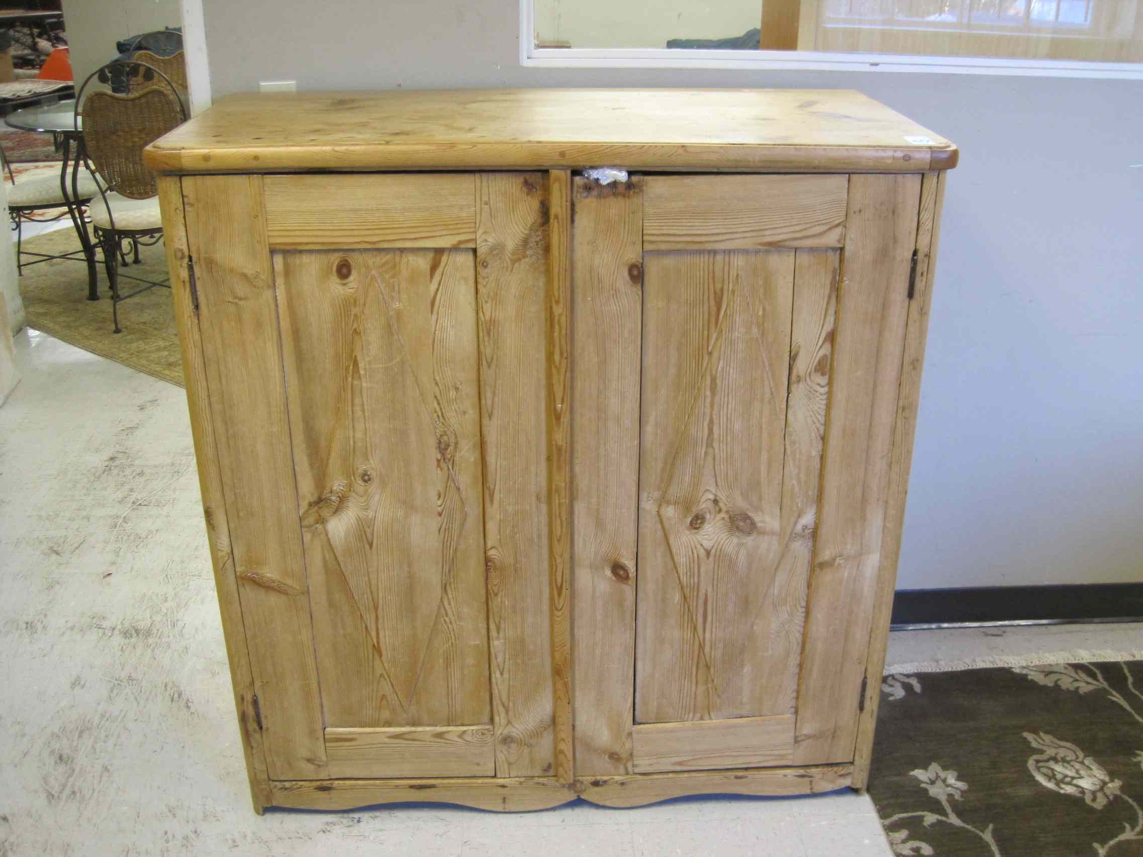 Appraisal: TWO-DOOR PINE CABINET Continental th century the doors opening to