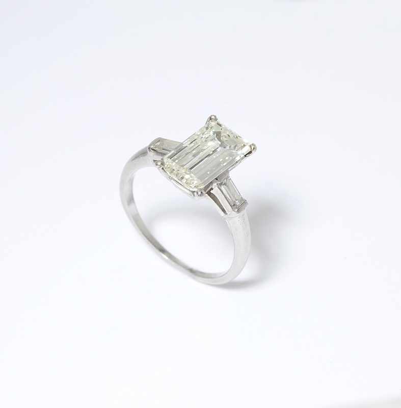 Appraisal: An Art Deco diamond ring Circa platinum centering a rectangular-cut