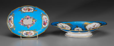 Appraisal: Two Sevres porcelain bowls both with floral reserves on blue