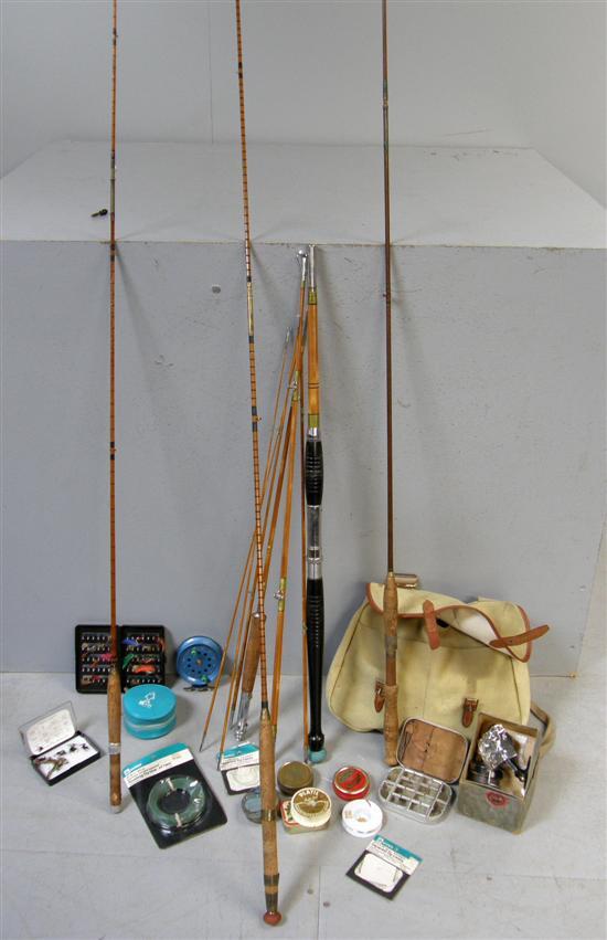 Appraisal: Four fishing rods a bag three reels fly box and