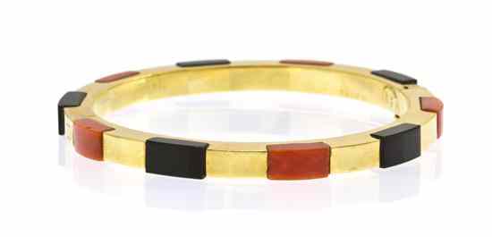 Appraisal: A Karat Yellow Gold Onyx and Coral Hinged Bangle Bracelet