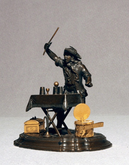 Appraisal: BRONZE DESK SET Patinated cast bronze figure of a magician