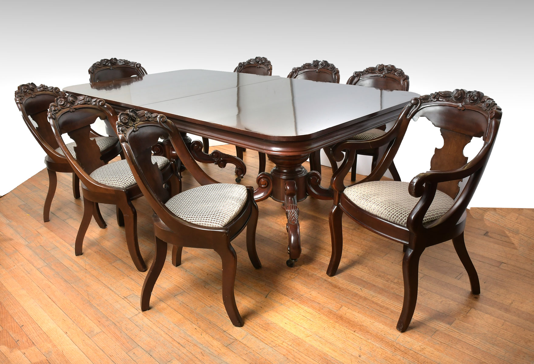 Appraisal: DINING TABLE WITH CHAIRS LEAVES Comprising craved chairs with floral