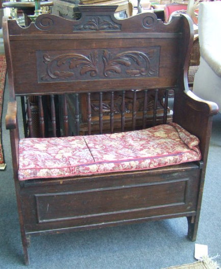 Appraisal: A th century oak high wing back hall bench with