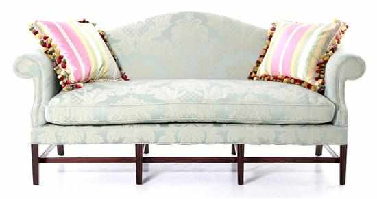 Appraisal: Upholstered mahogany camel-back sofa damask-upholstered back and armrest and cushion