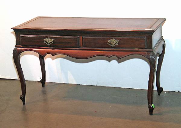 Appraisal: A Rococo style leather inset mahogany table mid th century