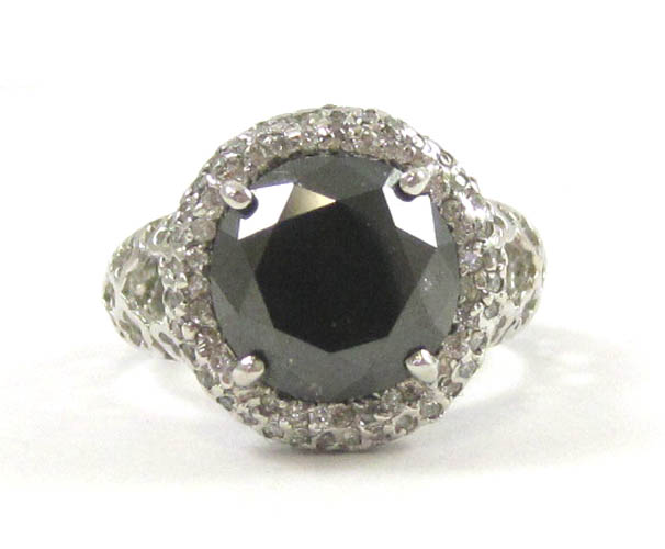 Appraisal: BLACK DIAMOND AND FOURTEEN KARAT WHITE GOLD RING with round-cut