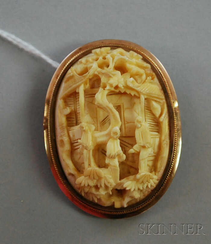 Appraisal: Low-karat Gold-framed Carved Ivory Pendant Brooch lg wd in