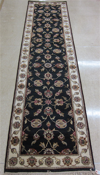 Appraisal: HAND KNOTTED ORIENTAL HALL RUG Indo-Persian floral Isfahan design on