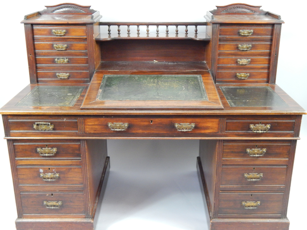 Appraisal: A Victorian mahogany twin pedestal desk with a central shelf