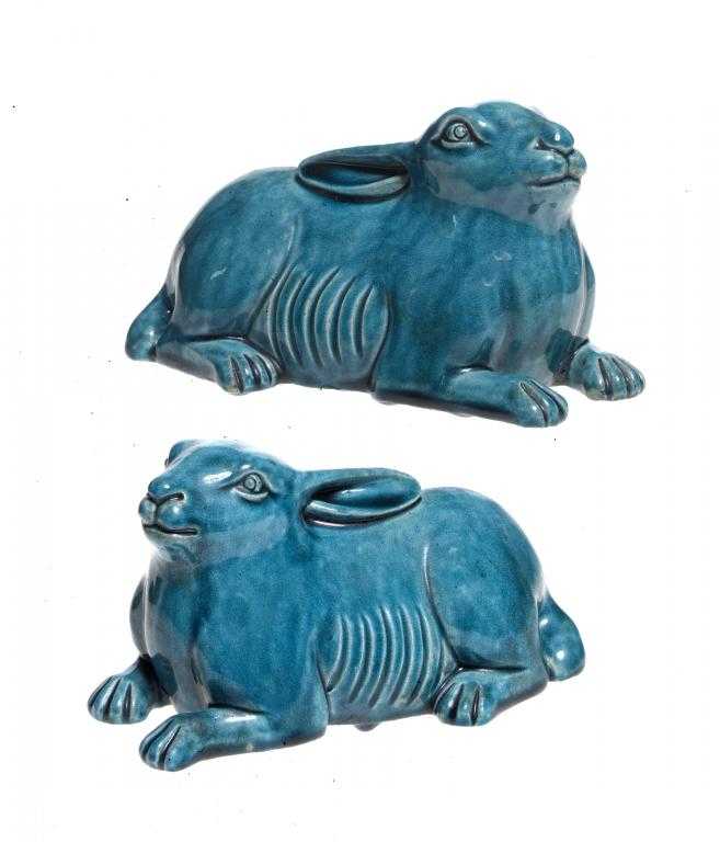 Appraisal: A PAIR OF CHINESE TURQUOISE GLAZED BISCUIT PORCELAIN MODELS OF