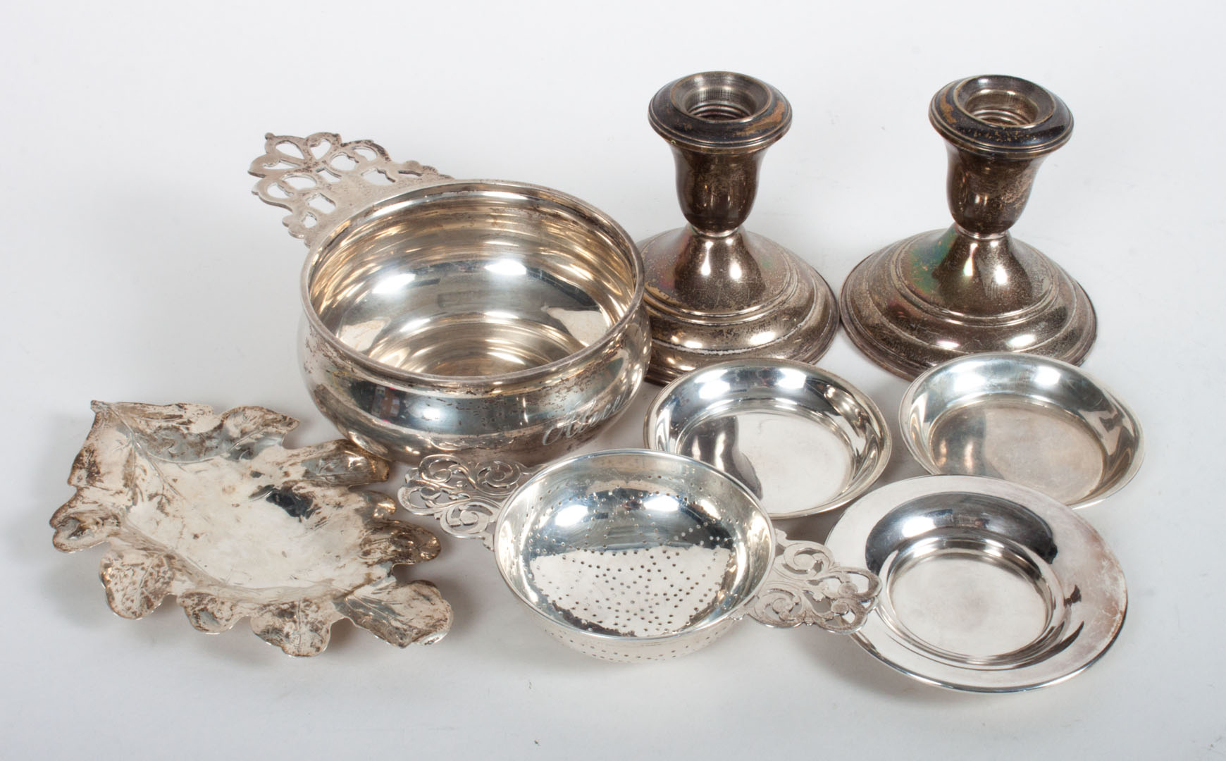 Appraisal: Seven sterling weighted silver table articles including Tiffany tea strainer