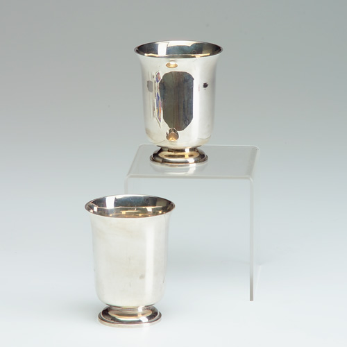 Appraisal: JEAN E PUIFORCAT Pair of French silver footed beakers with