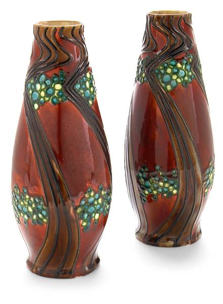 Appraisal: A pair of Mintons Secessionistware glazed earthenware vases - with